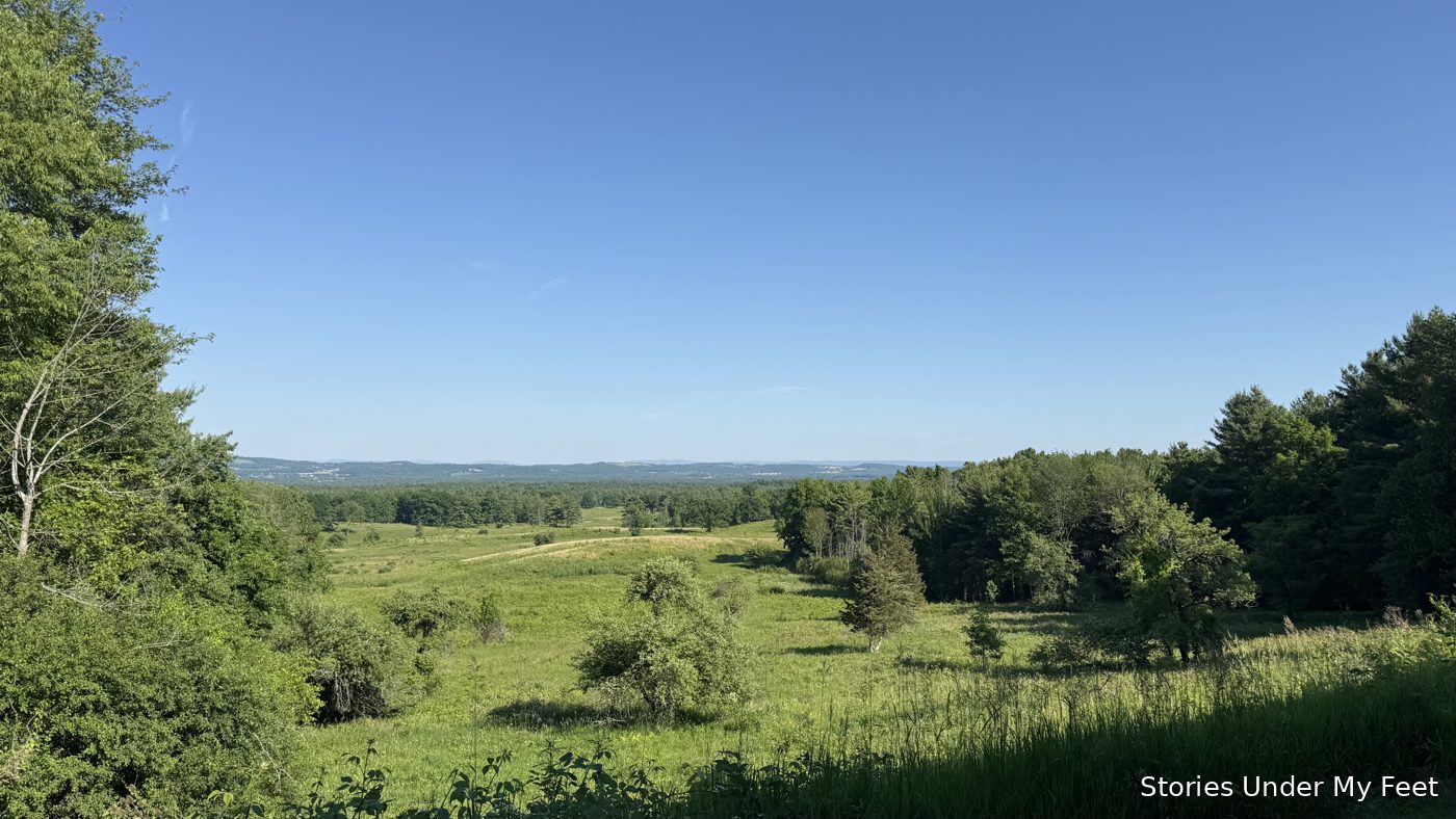 The battlefield from the visitor center overlook — green fields rolling toward the Hudson valley